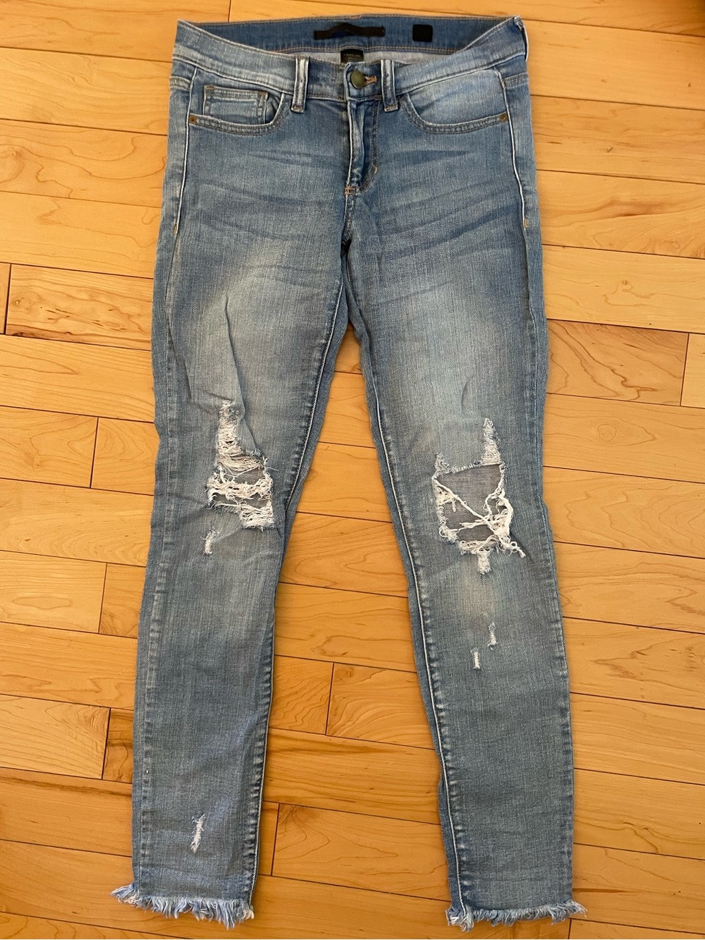 Distressed Light Blue Skinny Jeans with Frayed Hem